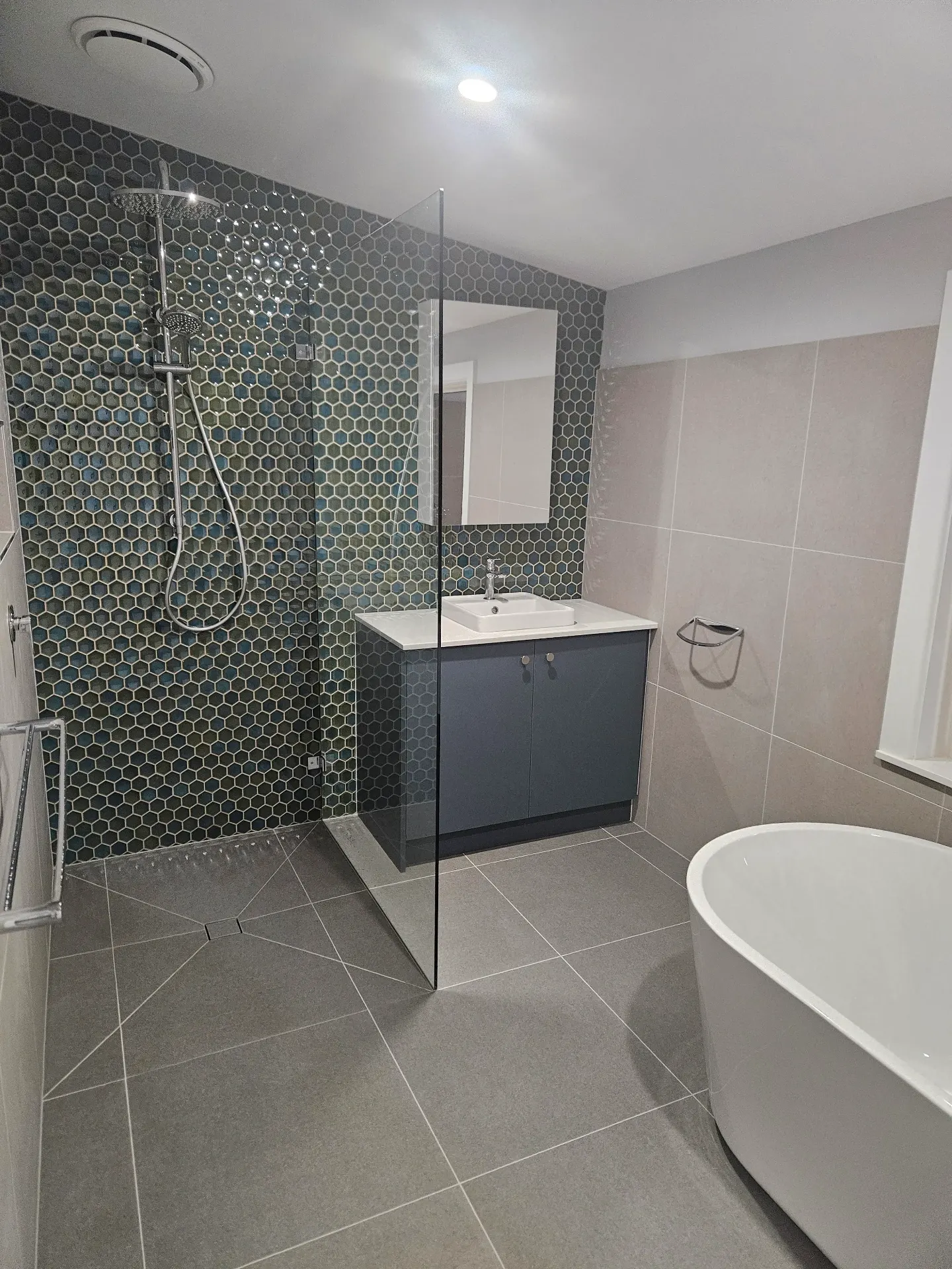 Toorak bathroom with green hex mosaic and freestanding tub
