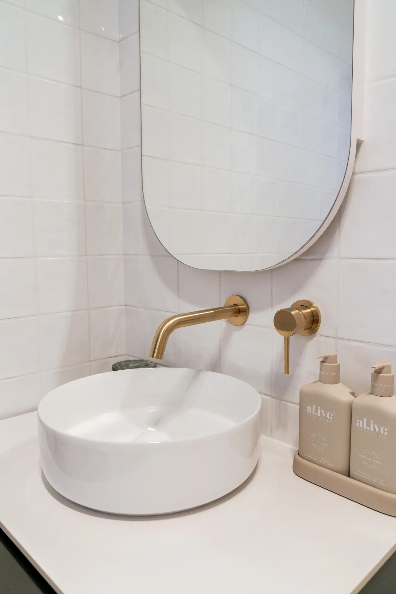 Editorial bathroom with brass vessel basin