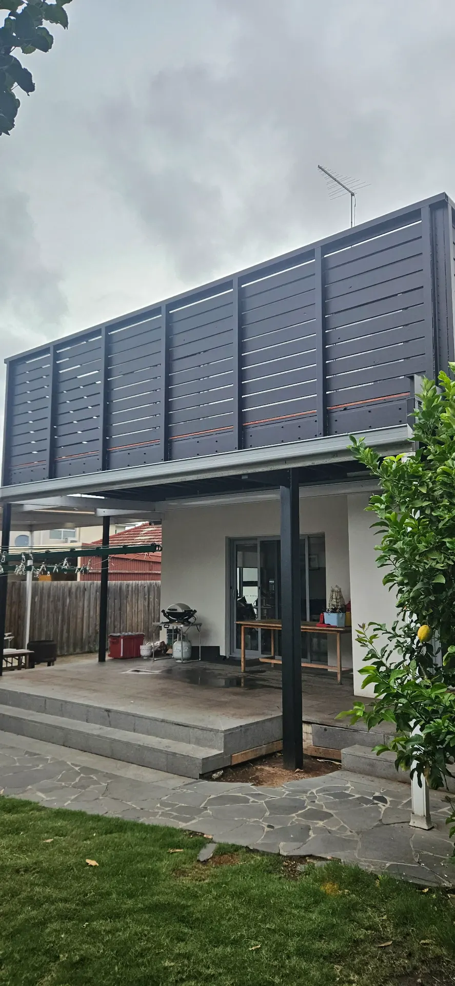 Second-storey extension with charcoal cladding